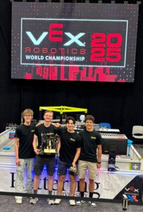 Robotics team posing for picture.