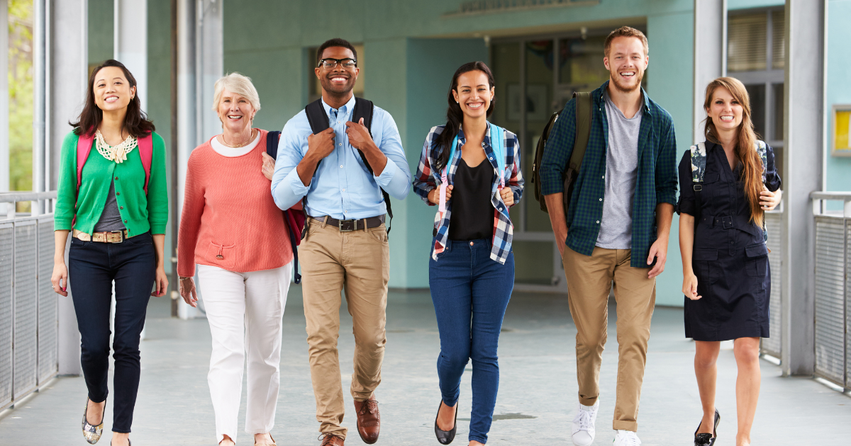 Adults with backpacks going to back to school night.